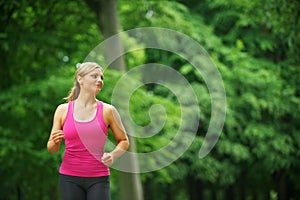 Young woman running alone in the park