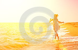 Young woman running on the beach