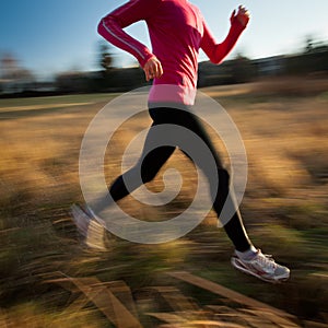 Young woman running outdoors