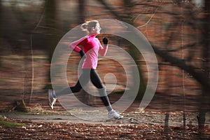 Young woman running outdoors