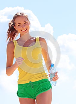 Young woman running outdoors