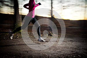 Young woman running outdoors in a city park