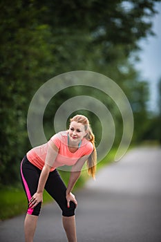 Young woman running outdoors on a lovely sunny  day
