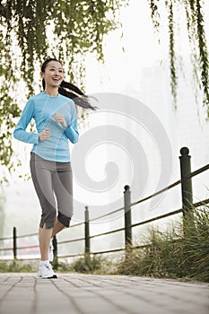 Young woman running in the park