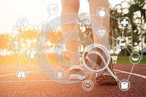 Young woman running during sunny morning on stadium track with n