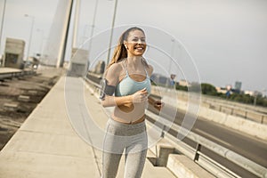 Young woman running in urban enviroment