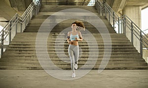 Young woman running in urban enviroment