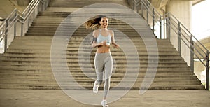 Young woman running in urban enviroment