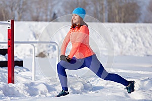 A young woman running winter