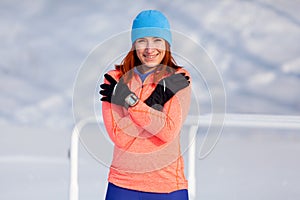 A young woman running winter