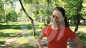 A young woman runs along the path stops