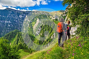 Young woman's hikers walking in mountains,Bucegi,Carpathians,Transylvania,Romania photo