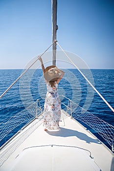 Young woman sailing, young adult lady enjoying summer travel, close-up portrait of female face, summer cruise holidays