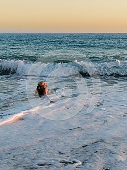 Young woman at sand beach. Relaxing enjoy holiday at tropical paradise beach at sunset. Girl in summer vacation