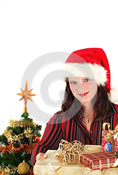 Young woman in Santa cap and presents