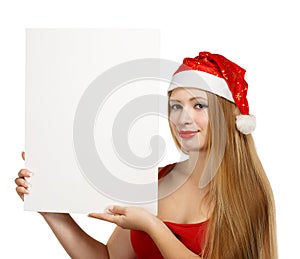 Young woman in santa claus hat with christmas card