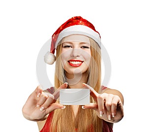 Young woman in santa claus hat with christmas greeting card