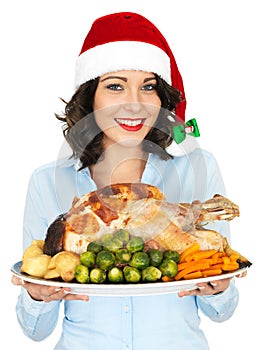 Young Woman in Santa Hat Holding Roast Turkey and Vegetables