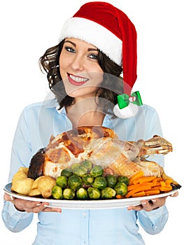 Young Woman in Santa Hat Holding Roast Turkey and Vegetables