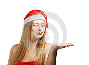 Young woman in santa hat with open hand