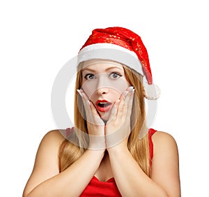 Young woman in santa hat surprised