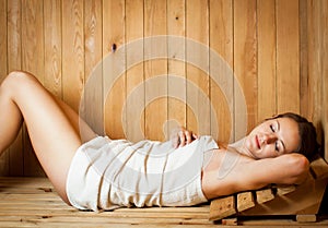 Young woman in a sauna