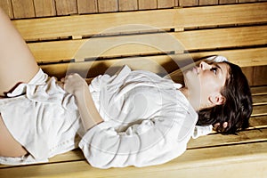 Young woman in the sauna