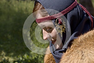 Young woman in the Scandinavian historical suit