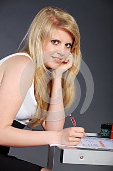 Young woman with schoolwork