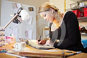 Young Woman Scrapbooking At Home