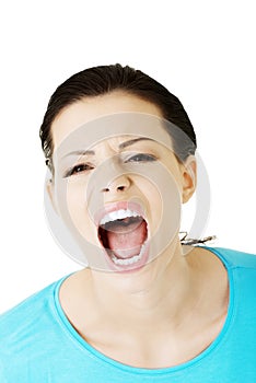 Young woman screaming with anger