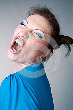 Young woman screaming in joy