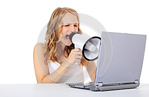 Young woman screaming at laptop
