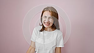 Young woman screaming loudly over isolated pink background