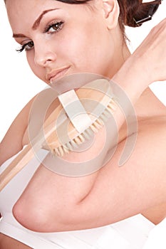 Young woman scrubbing body. photo