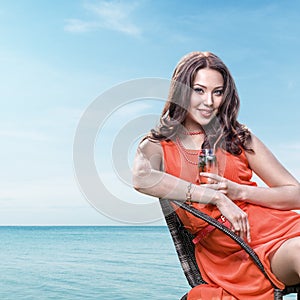 Young woman in seaside cafe