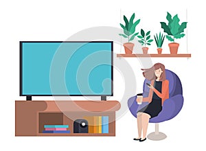 Young woman seated in the sofa watching tv