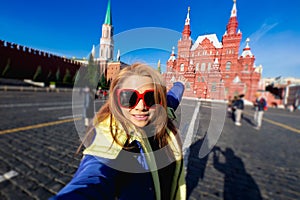 young woman with selfie by smartphone at State Historical Museum in Red square