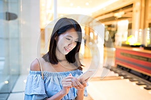 Young Woman sending sms on mobile phone