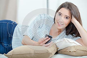 Young woman sending text message