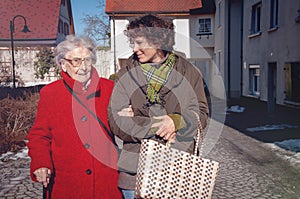 Young woman and senior woman going for shopping