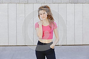 Young woman with a serious attitude isolated on the street