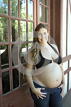 Young woman seven months pregnant