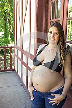 Young woman seven months pregnant