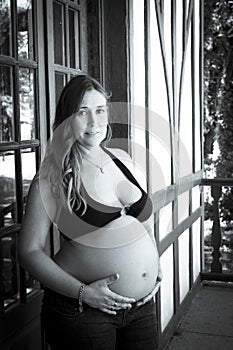 Young woman seven months pregnant