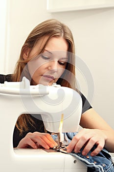Young woman sewing