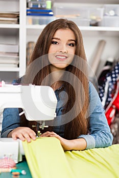 Young woman at a sewing machine