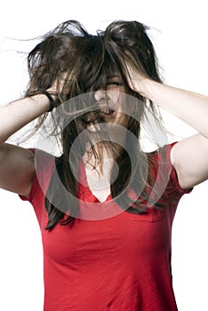 Young woman shaking her hair