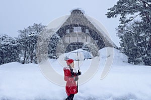 Young woman in Shirakawa-go village in winter, UNESCO world heritage sites, Japan