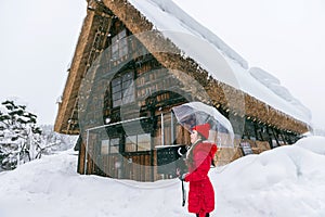 Young woman in Shirakawa-go village in winter, UNESCO world heritage sites, Japan